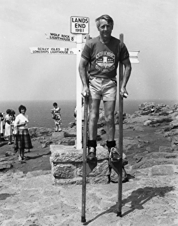 Marathon stilt walker at Lands End, Cornwall Marathon stilt walker at Lands End, Cornwall