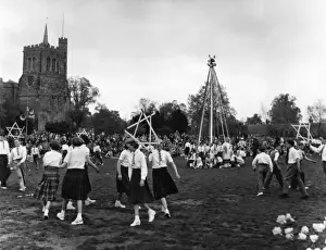 Prints of Boys and girls perform traditional English dances on the village green at Elstow, Bedfordshire, England including a sword dance and maypole dances. Date: 1950s Dance Prints: English Village May Day Print 1950s