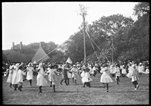 Prints of Children dance round the pole at an English country fete Dance Prints: Maypole Dance Print: Children Dancing Around a Pole