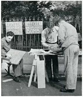 Preparations Gallery: Men painting warning signs for unexploded bombs, Sept 1939