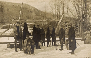 Men with rifles, black bears and dogs, USA Men with rifles, black bears and dogs, USA