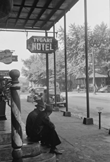 Men sitting on steps of hotel, Elkins, West Virginia Men sitting on steps of hotel, Elkins, West Virginia