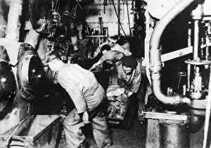 Men at work in engine room of a ship, WW1 Men at work in engine room of a ship, WW1
