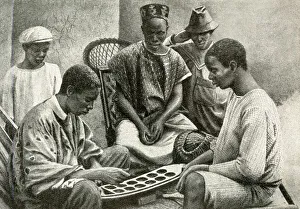 Mende men playing Warri, Gold Coast, West Africa Mende men playing Warri, Gold Coast, West Africa