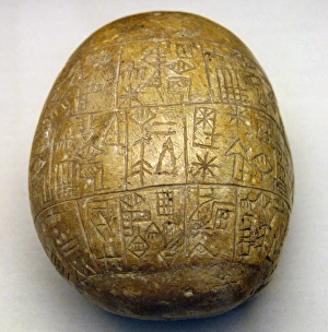Mesopotamia. Early Dynastic Period III. Votive pebble with i Mesopotamia. Early Dynastic Period III. Votive pebble with i