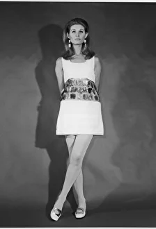 <b class=qtipBold><figcaption>Metal Disc Dress 1968</figcaption></b><br>Mini-dress: bodice & skirt are joined by a band of flat metal discs riveted to transparent plastic - a futuristic style reminiscent of Paco Rabanne's metal dress of 1967.<br><em>© Mary Evans Picture Library</em> Metal Disc Dress 1968
