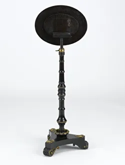 <b class=qtipBold><figcaption>Metamorphic table</figcaption></b><br>Ebonised mahogany metamorphic table on three scrolled feet with floral gilt metal decoration, manufactured in England c.1820. Date: c.1820<br><em>© The Geffrye Museum of the Home / Mary Evans Picture Library</em> Metamorphic table