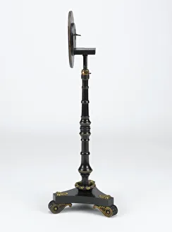 <b class=qtipBold><figcaption>Metamorphic table</figcaption></b><br>Ebonised mahogany metamorphic table on three scrolled feet with floral gilt metal decoration, manufactured in England c.1820. Date: c.1820<br><em>© The Geffrye Museum of the Home / Mary Evans Picture Library</em> Metamorphic table