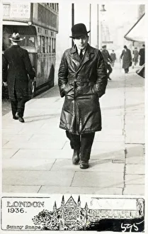 Middle aged in a black leather full length overcoat - Street Middle aged in a black leather full length overcoat - Street
