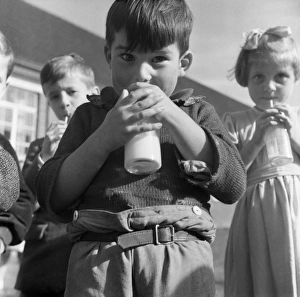 <b class=qtipBold><figcaption>Milk for school children, 1955</figcaption></b><br>Before Margaret 'Thatcher the milk snatcher' put and end to free school milk for the over sevens, all primary school children would enjoy their daily third pint 'ration' at school. Fortunately in the mid 1950's these children at Harwich Road Primary, Colchester, had nothing to fear. They've all gotta lotta bottle.<br><em>© Mary Evans Picture Library/HENRY GRANT</em> Milk for school children, 1955