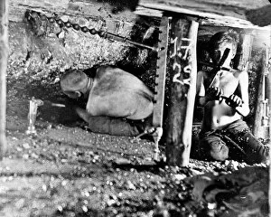 Jones Collection: Two miners in a narrow coal seam, South Wales