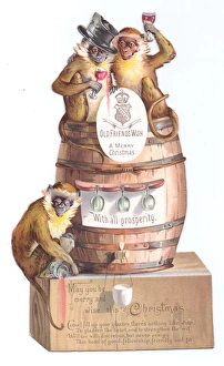 Three monkeys with barrel on a cutout Christmas card Three monkeys with barrel on a cutout Christmas card