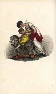 Mother giving her child a riding lesson Mother giving her child a riding lesson