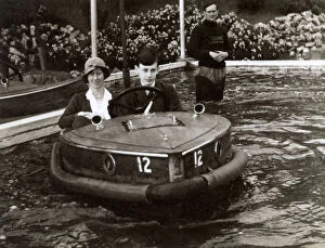 Llandudno Gallery: Mother and son riding a Rytecraft Scoota-boat - Llandudno