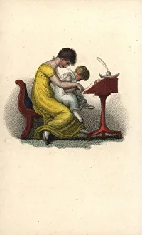 Mother teaching her child to write at a writing desk Mother teaching her child to write at a writing desk