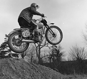 Motorcyclist taking off into the air Motorcyclist taking off into the air