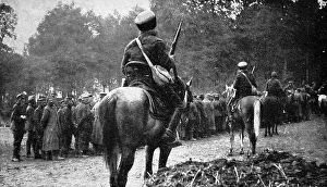 Mounted French Spahis guarding German prisoners; First World Mounted French Spahis guarding German prisoners; First World