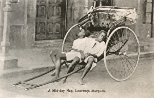 Mozambique - Maputo - Two Rickshaw Boys take a nap Mozambique - Maputo - Two Rickshaw Boys take a nap