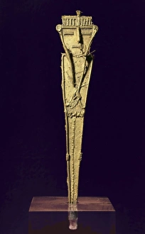 Muisca gold pendant. The tunjo of a warrior with Muisca gold pendant. The tunjo of a warrior with