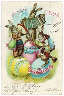 Three musical hares on three decorated Easter eggs Three musical hares on three decorated Easter eggs