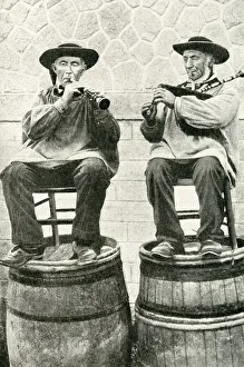 Musicians seated on barrels, Brittany, Northern France Musicians seated on barrels, Brittany, Northern France