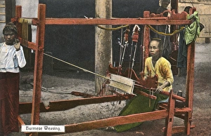 Myanmar - A weaver at work using a wooden frame loom Myanmar - A weaver at work using a wooden frame loom