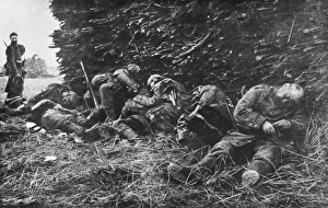 <b class=qtipBold><figcaption>Napping soldiers WWI</figcaption></b><br>Catching a nap under a pile of wood before the next onslaught during the First Battle of the Marne.<br><em>© Mary Evans/Robert Hunt Collection</em> Napping soldiers WWI