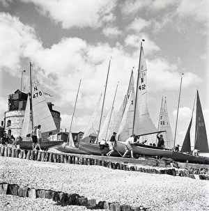 National 12 sailing dinghies on a Devon beach National 12 sailing dinghies on a Devon beach