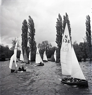 National 12 sailing dinghies on a Devon river National 12 sailing dinghies on a Devon river