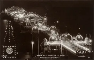 Prints of Palace Pier at night, Brighton, Sussex. Date: circa 1915 Palace Prints: Palace Pier at Night, Brighton Print, circa 1915