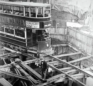 London Underground History Prints: A London tram passing over cut and cover works