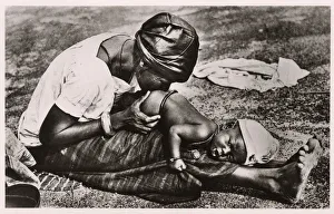 Niger, West Africa - Baby receiving an enema Niger, West Africa - Baby receiving an enema