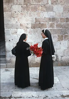 Two nuns chat in the streets of Dubrovnik, Croatia Two nuns chat in the streets of Dubrovnik, Croatia