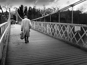 Old man crosses Queens Park suspension footbridge, Chester Old man crosses Queens Park suspension footbridge, Chester