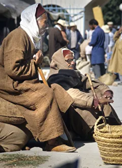 Two old men with djellebas and chechia hats Two old men with djellebas and chechia hats