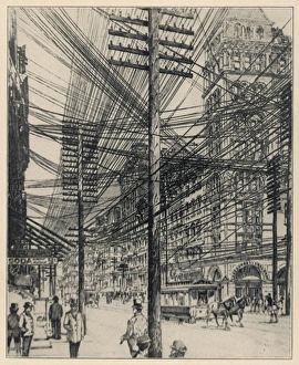 <b class=qtipBold><figcaption>Overhead Phone Wires, NY</figcaption></b><br>Overhead telephone wires at the junction of Broadway and John Street, New York<br><em>© Mary Evans Picture Library</em> Overhead Phone Wires, NY