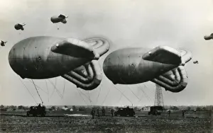 Prints of A Pair of RAF Barrage Balloons at Cardington, Bedfordshire Bedfordshire Prints: A Pair of RAF Barrage Balloons at Cardington Print