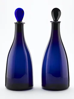 <b class=qtipBold><figcaption>A pair of decanters</figcaption></b><br>Decanter of tapered form made from blown and bevelled blue glass, with a later pear-shaped stopper, one of a pair made in England c.1790. Date: c.1790<br><em>© The Geffrye Museum of the Home / Mary Evans Picture Library</em> A pair of decanters