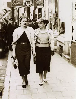 Passing Gallery: A pair of rich girls off shopping - passing an Etam Store