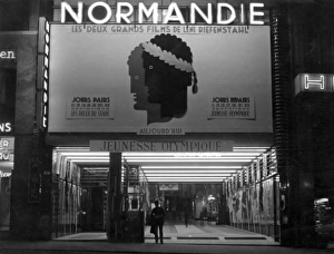 The Normandie cinema on the Champs Elysees, Paris, France, where Leni Riefenstahl's film Jeunesse Olympique of the 1936 Berlin Olympic Games, is showing. Date: late 1930s Paris Cinema 1930S