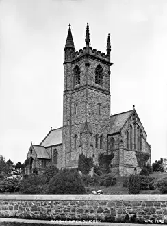 Prints of Parish Church, Dundrum - an oblique front view from the road. (Location: Northern Ireland: County Down: Dundrum). Date: circa early 1900s Down Prints: Early 20th Century Dundrum Parish Church Print