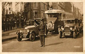 Parisian Officer directing traffic on Les Grand Boulevards Parisian Officer directing traffic on Les Grand Boulevards