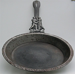 A patriotic cast iron frying pan with German soldier A patriotic cast iron frying pan with German soldier