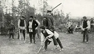 Peasant men playing a game in a field, Finland Peasant men playing a game in a field, Finland
