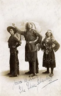 Three people in Cowboy and Indian costume in studio photo Three people in Cowboy and Indian costume in studio photo