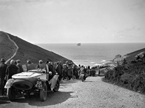 People on road sloping down to the sea People on road sloping down to the sea