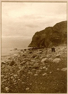 Two people on a rocky beach, North Wales Two people on a rocky beach, North Wales