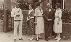 Five people standing outside a house Five people standing outside a house