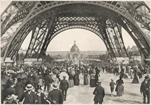<b class=qtipBold><figcaption>People under Tour Eiffel</figcaption></b><br>Crowds of people milling about underneath the Eiffel Tower during the Exposition Universelle, Paris.<br><em>© Mary Evans Picture Library</em> People under Tour Eiffel