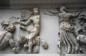 Pergamon Altar. The Titan Phoebe with a torch fighting again Pergamon Altar. The Titan Phoebe with a torch fighting again